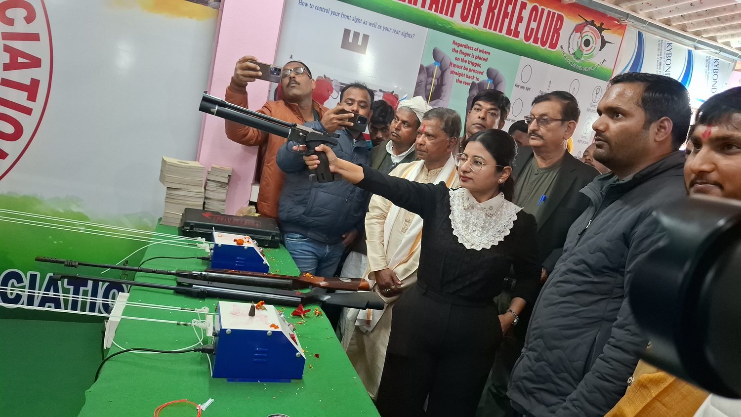 SDM firing an air pistol at the Muzaffarpur Rifle Club inauguration
